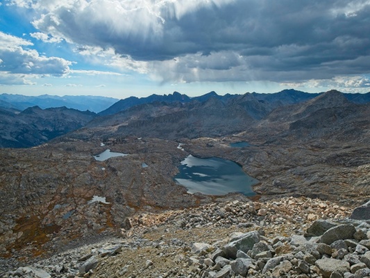 Sun streams through the clouds into Palisade Basin palisade basin