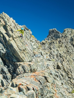 Dagmar climbs down an exposed rock during the traverse to Virginia Peak twin peaks ridge