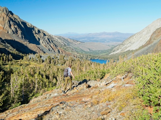 With the sun dipping low in the sky, Craig hurries down the path toward Green Lake virginia pass