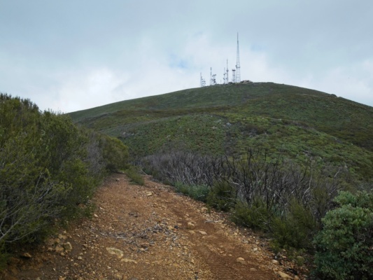 The clouds begin to clear a bit as we hike toward the second high point cerro bola radio towers