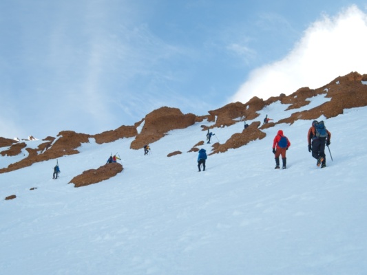 Climbers ascend through the Red Banks mount shasta avalanche gulch