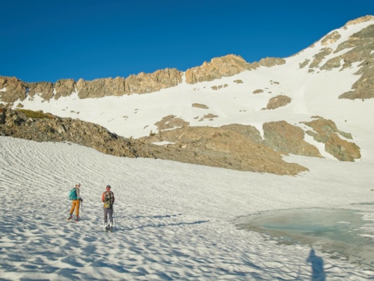 Erica and Alex discuss options to ascend the slope ahead golden trout lake ski mountaineering
