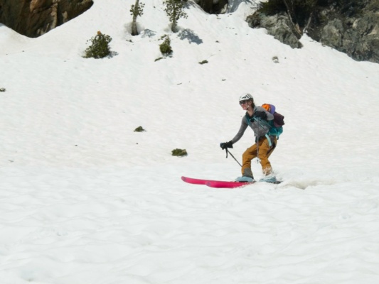 Erica skis down the canyon ski mountaineering