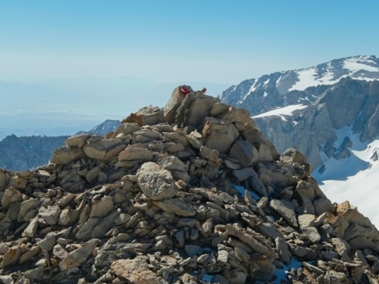 Erica rests on one of the summit pinnacles mount gould
