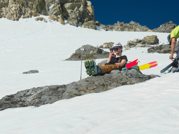 Erica checks the map during a break where we transition from skins to crampons mount gould ski mountaineering