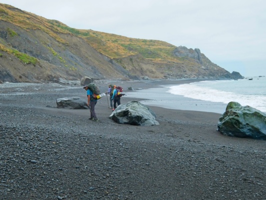 We hike along the wet sand at low tide through an impassable zone lost coast trail