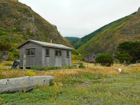 A pair of cabins near Fourmile Creek lost coast trail