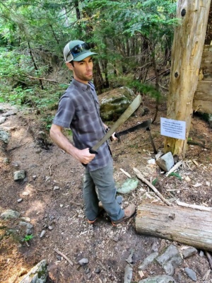 I pose with a couple of the machetes. Photo credit: Craig B. machetes