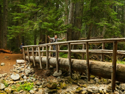 Craig J. crosses a bridge glacier peak trail