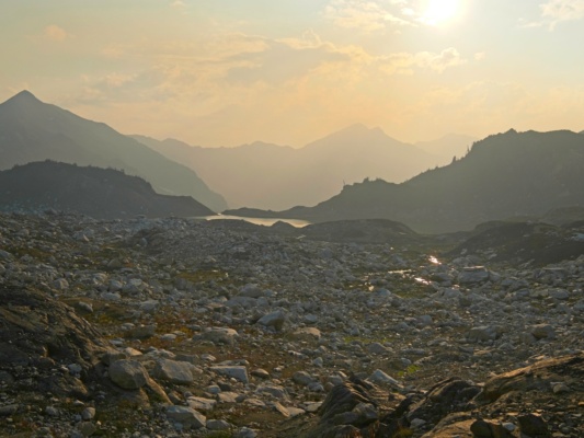 Smoke casts an orange glow over the valley smoky mountains