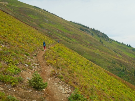 The trail contours across the hillside glacier peak trail