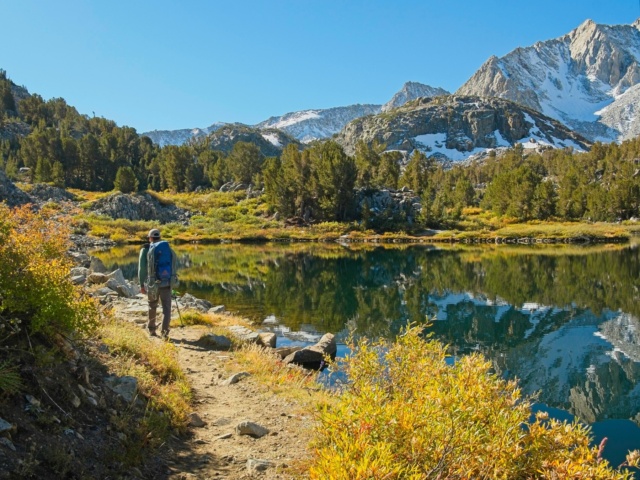 Josh walks along the lake bishop pass trail