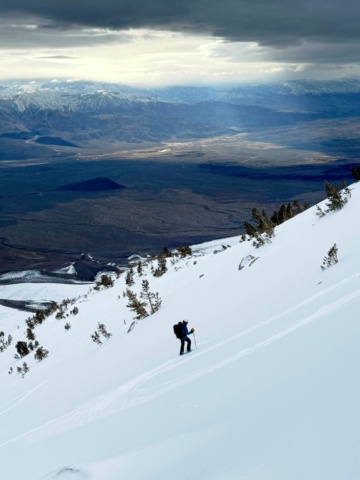 Maddie cuts fresh turns into the powder birch mountain