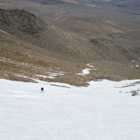 Maddie skiing down the lower canyon birch mountain ski mountaineering