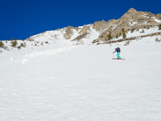 We traverse below an avalanche debris field that slid over a week ago birch mountain ski mountaineering