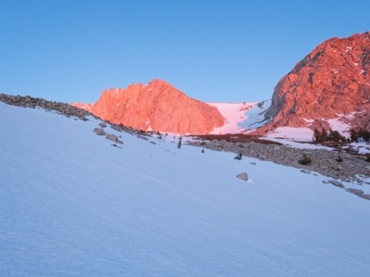 Alpenglow illuminates the cliff faces above us alpenglow