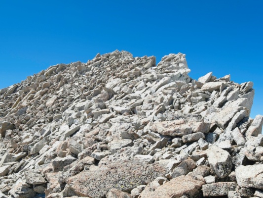 Dry, stable talus is a nice change from the softening snow - the Mount Barnard summit is up there! mount barnard