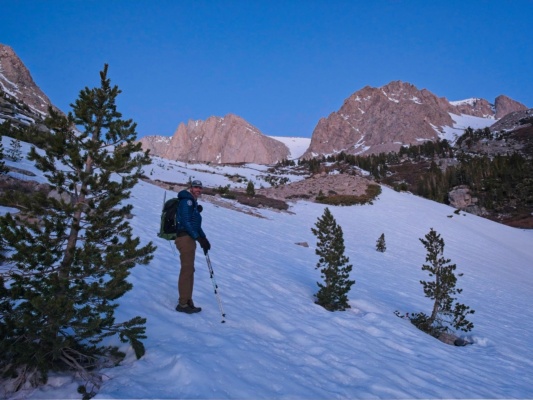 We hike up the low-angle snow in trail runners mountaineering