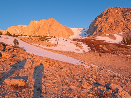 Golden light bathes the alpine landscape mountain sunrise