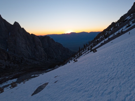 The begins to peek over the eastern mountains sunrise