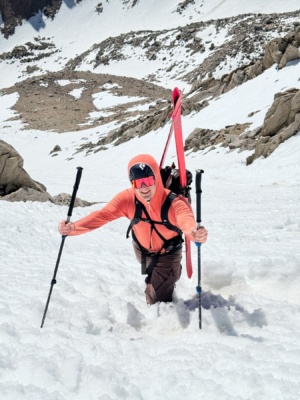 Andrew boots up through the steep snow ski tour