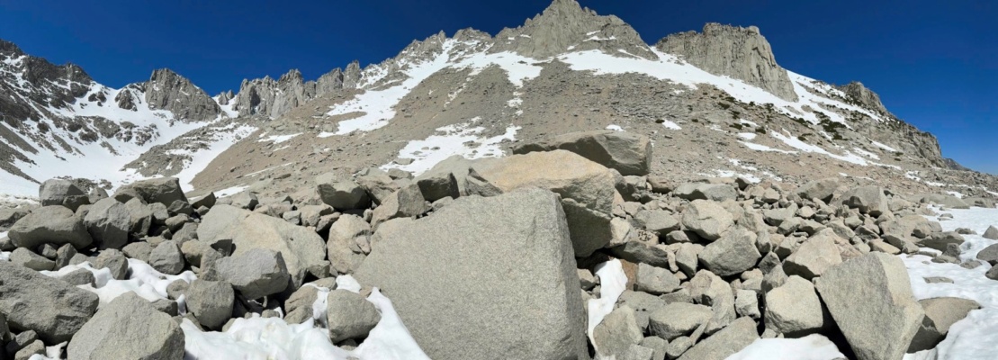 A panoramic view of the bowl east of University Peak; we traversed across that thin snow band below the cliffs sierra canyon