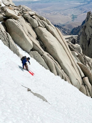 Andrew bombs down the slope, looking like an absolute badass ski tour