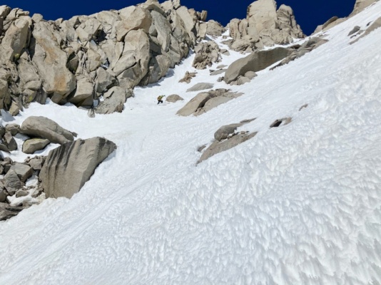 I start down the couloir (pentitentes in the foreground!) ski tour