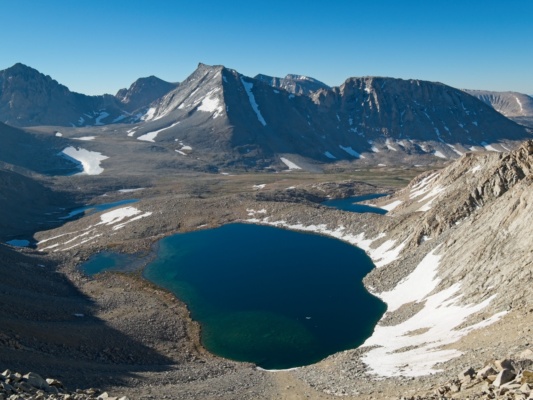 A smattering of lakes below Junction Peak with the sharp ridges of Mount Tyndall in the background junction peak lakes