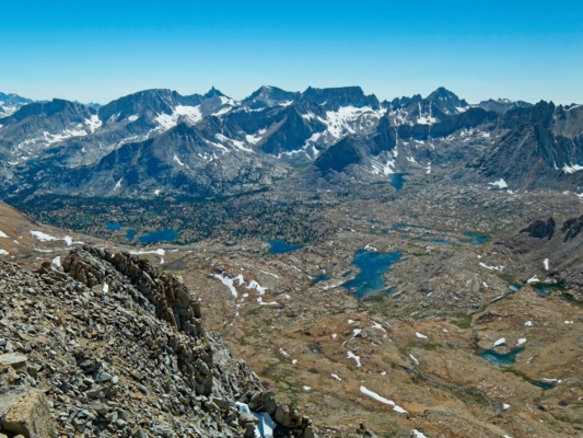 A rugged, lake-filled basin at the feet of the Great Western Divide alpine lakes