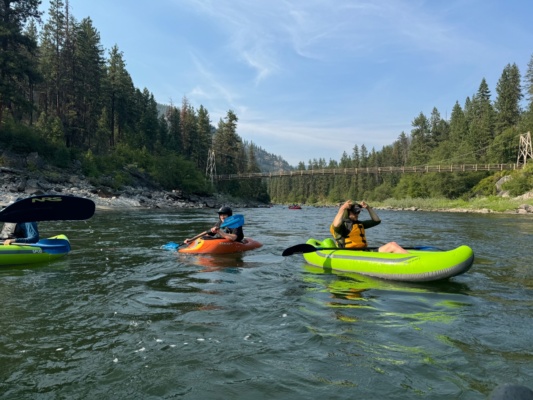 Mason and Brian with a suspension bridge in the background main salmon river rafting