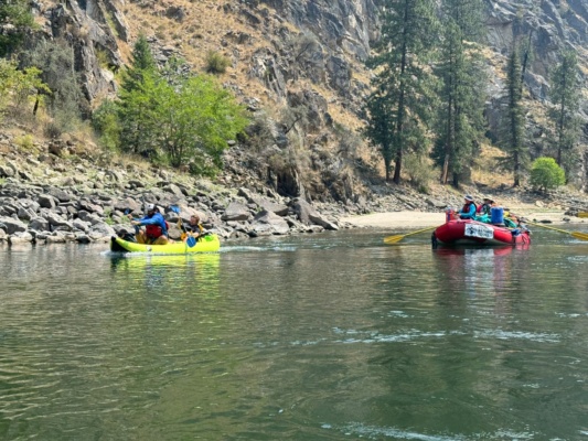 Aaron and Christopher charge past Kaleb and Matt in the raft main salmon river rafting