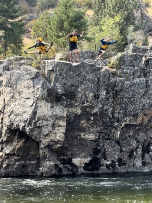 Brian, Christopher, and Jason leap from the cliff main salmon river rafting
