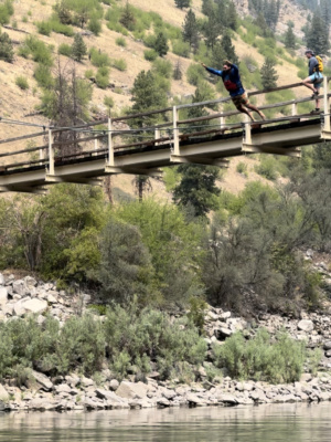 Aaron leaps from the bridge main salmon river rafting