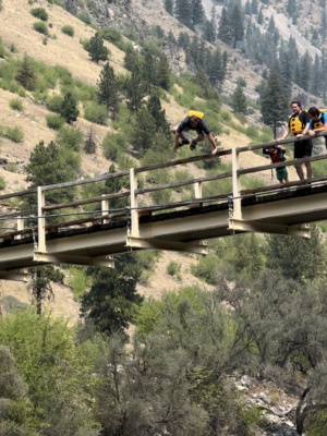 Isaac soars over the bridge railing and into the river main salmon river rafting