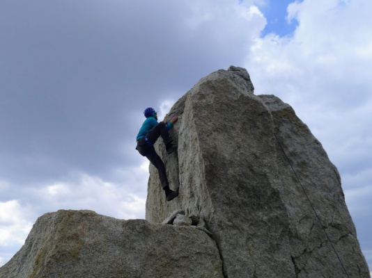 Craig climbs the summit block on The Hermit. Photo credit: Kurt the hermit
