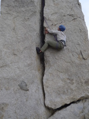 I climb the summit block as a lieback. Photo credit: Kurt the hermit