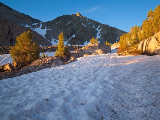 I walk up the frozen, sun-cupped snow easily enough black diamond traverse