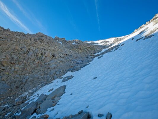 Since I have crampons and good boots, I side-step up the icy snow as far as I can; it beats slogging through the loose rocks! black diamond traverse