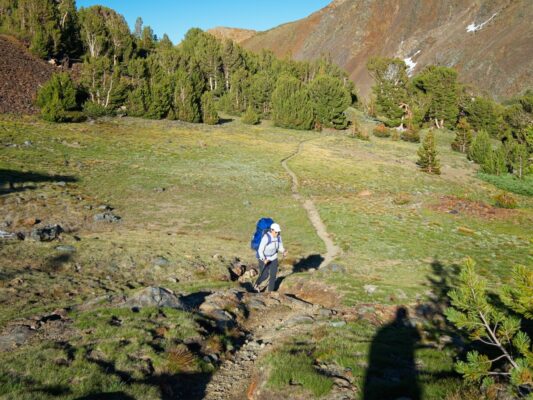 Kenza hikes up the trail near Mono Pass bloody canyon trail