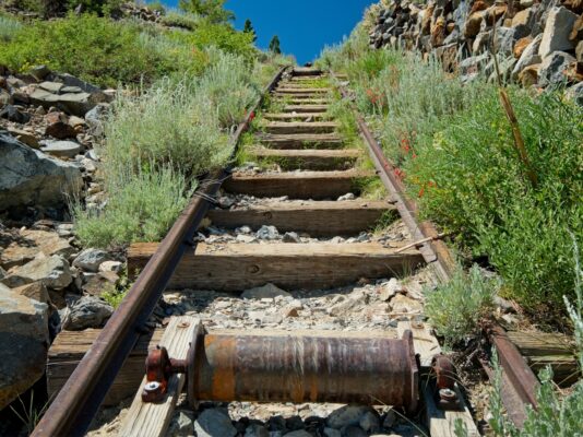 A close up view of the tramway and a cylinder that kept the cable from hitting the cross beams agnew tramway train
