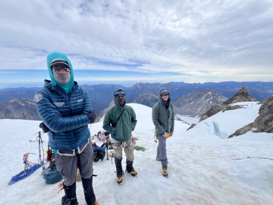Craig, myself, and Josh waiting to climb the summit block; photo credit: Cody mountaineering