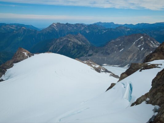 A view from the summit; you can see the moraine trail way down below mount olympus