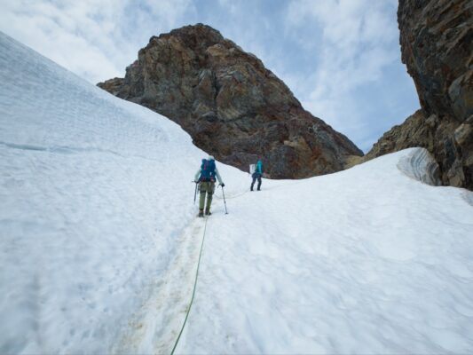 Cody and Craig climbing through Crystal Pass mountaineering