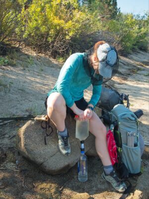 Shannon filters water from Spooner Lake tahoe rim trail