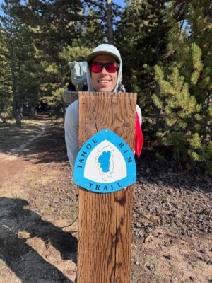 I pose in front of a particularly large trail blaze. Photo credit: Shannon tahoe rim trail