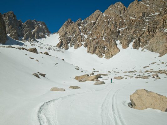 Maddie leads the way into the couloir basin mountain