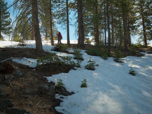 Roland skins along a thin ribbon of snow on the Horizon Ridge route ostrander ski hut
